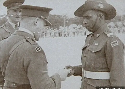 An officer inspected on parade, Korea era.
